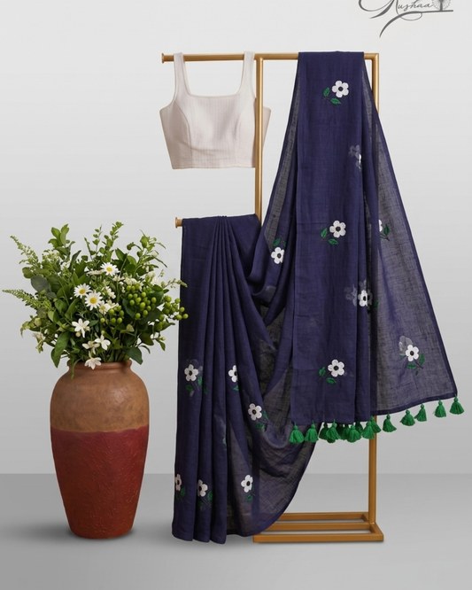 Elegant Navy Blue Mulmul Saree with Floral Embroidery & Green Tassel Border
