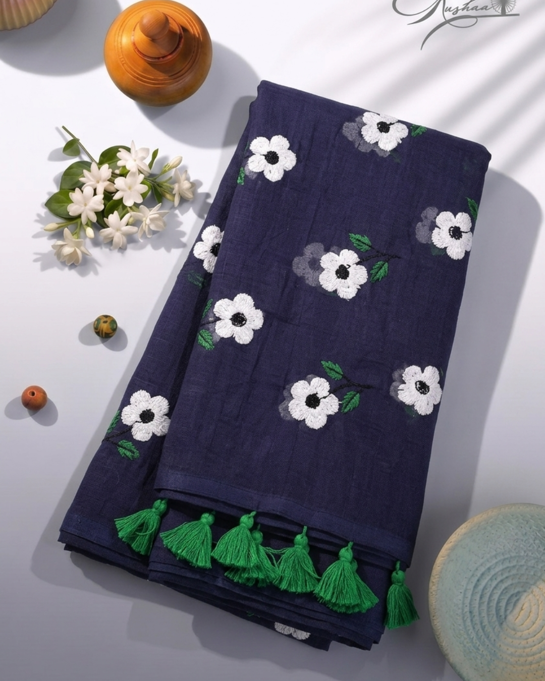 Elegant Navy Blue Mulmul Saree with Floral Embroidery & Green Tassel Border