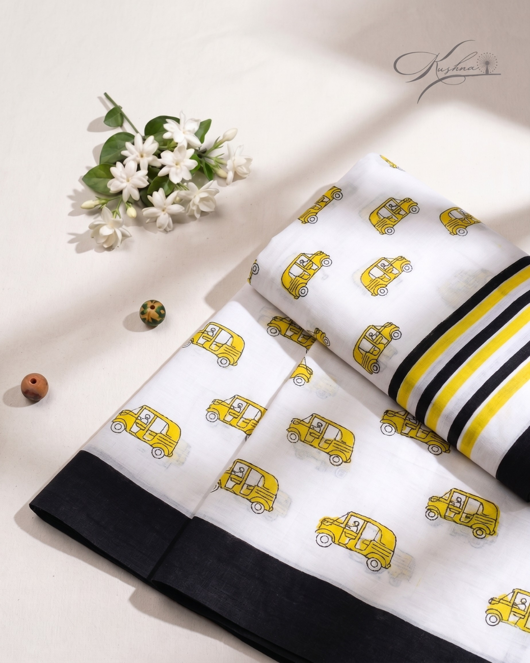 Stylish Off-White Mulmul Saree with Yellow Car Print & Striped Border